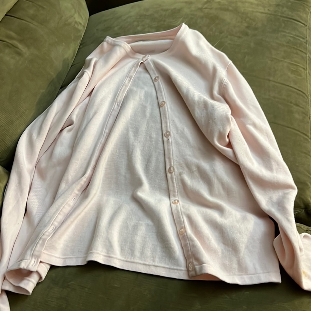 A pink cardigan